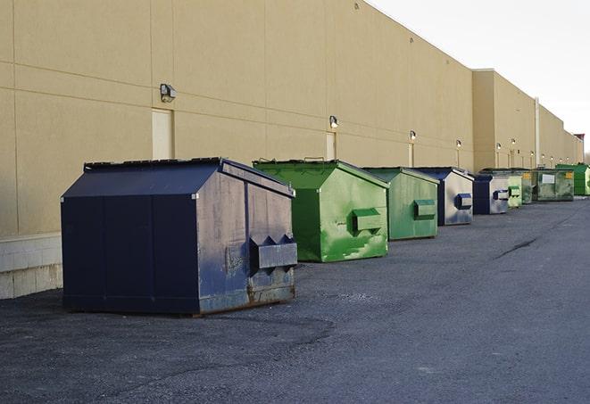 a row of blue construction dumpsters on a job site in Blairsden Graeagle